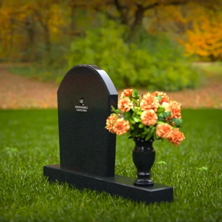 Classic arched granite headstones with single flower vase tribute.