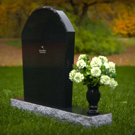 Arched granite headstones with elegant form and flower vase.