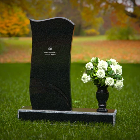 Modern curved granite headstones with engraved detailing for tribute.
