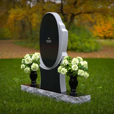 Modern oval granite headstones with layered base for elegant tribute.