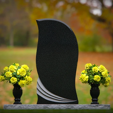 Elegant curved granite headstones with wave accents for timeless memorials.