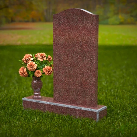 Modern upright headstones with gentle curves and vase tribute.