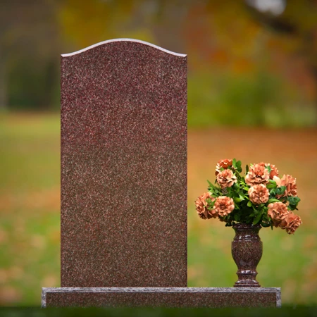 Modern upright headstones with gentle curves and vase tribute.