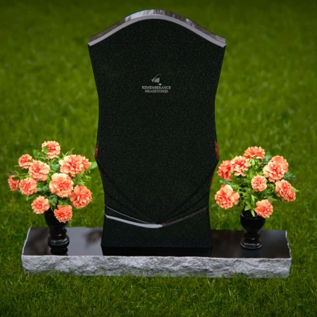 Elegant headstones with unique contours and dual flower vases.