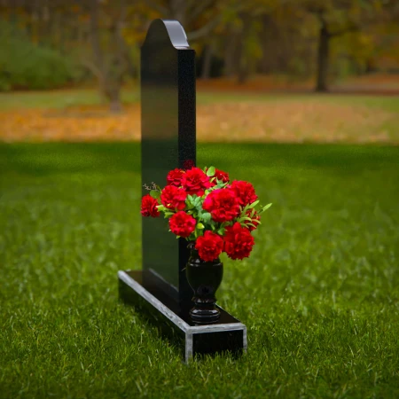 Classic upright headstones with flower vase for timeless memorials.