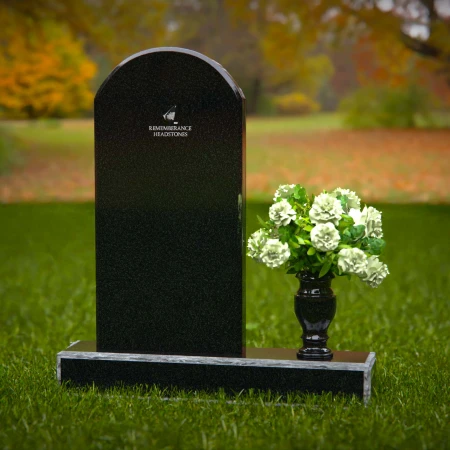 Classic arched headstones with a single flower vase for tribute.