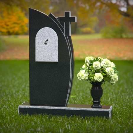 Unique headstones featuring a cross and elegant plaque design.