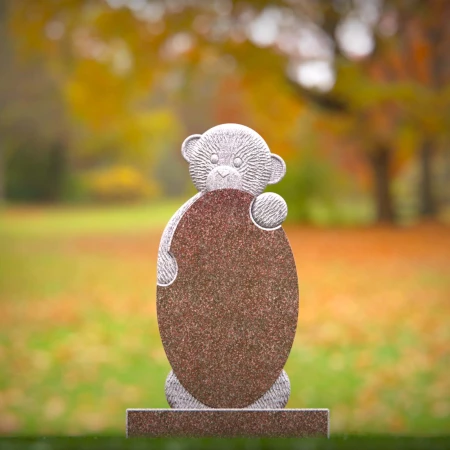 Playful memorials with sculpted bear for children’s headstones