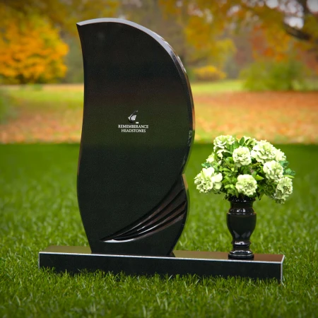 Modern curved headstones with single flower vase for memorials.