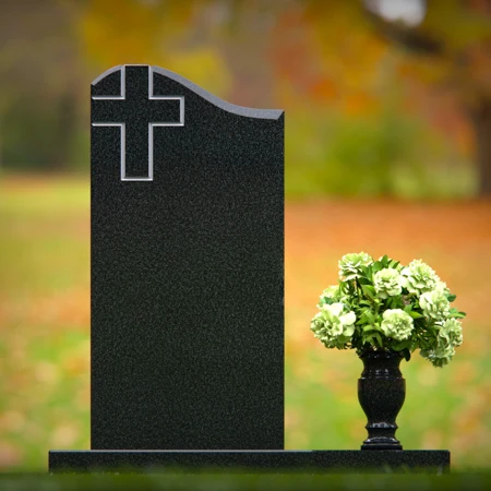 Granite headstones featuring a cross design and flower vase.
