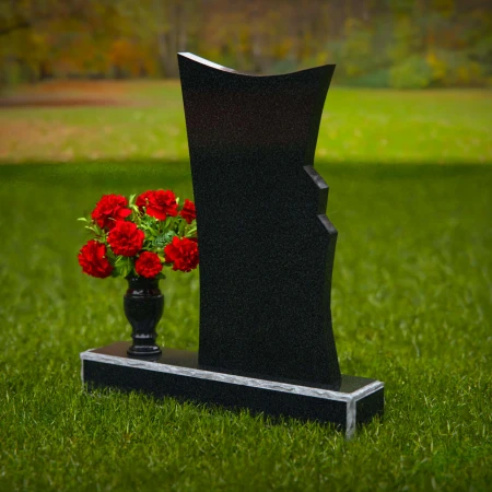 Contemporary granite headstones with unique shape and flower vase.