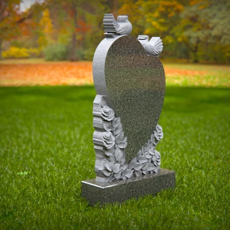 Doves rise around heart shape etched with floral memory in grave markers