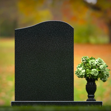 Timeless upright headstones with rounded top for elegant tribute.