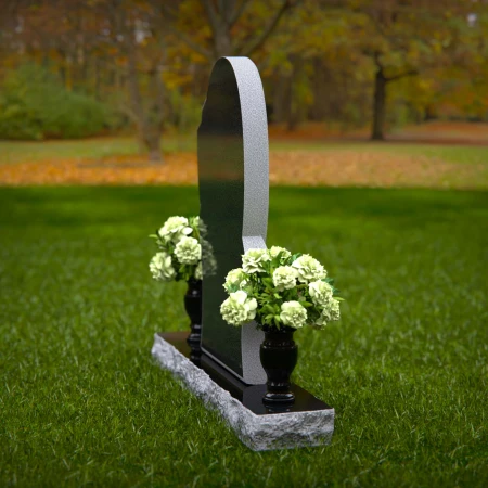 Modern oval granite headstones with layered base for elegant tribute.