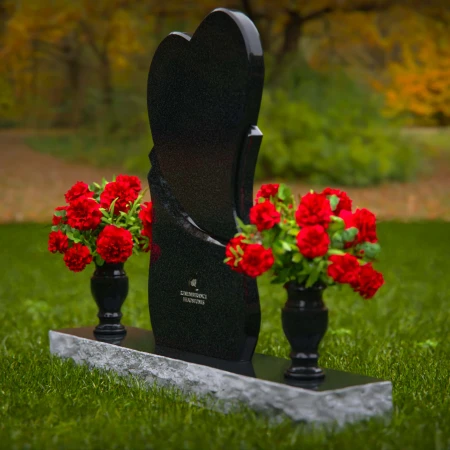 Unique dual heart headstones with twin flower vases for memorials.