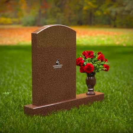 Beautiful upright headstones with flower vase details.