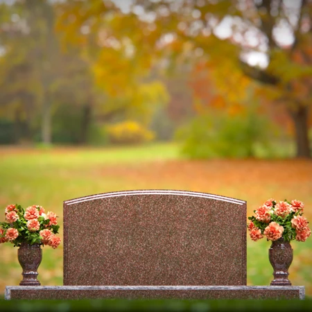 Dual vase headstones with arched design honoring shared memories.