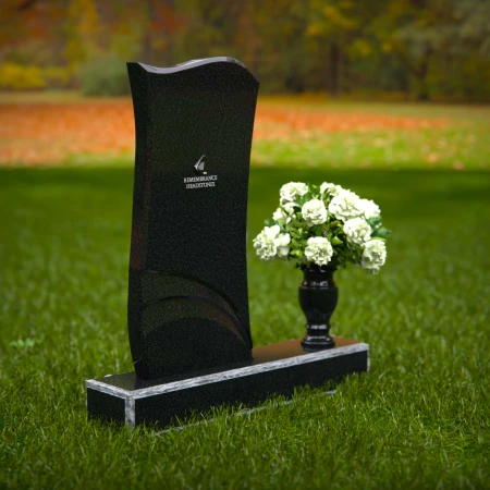 Modern curved granite headstones with engraved detailing for tribute.