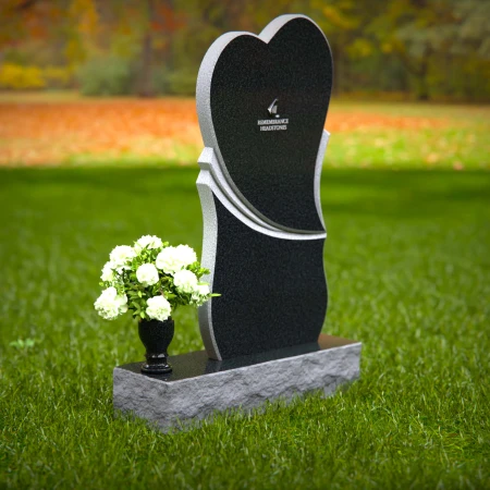 Modern heart-shaped granite headstones with elegant layered design.