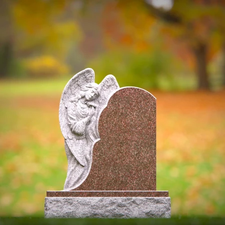 Graceful presence keeps memory alive through memorials, headstone, and grave ornaments.