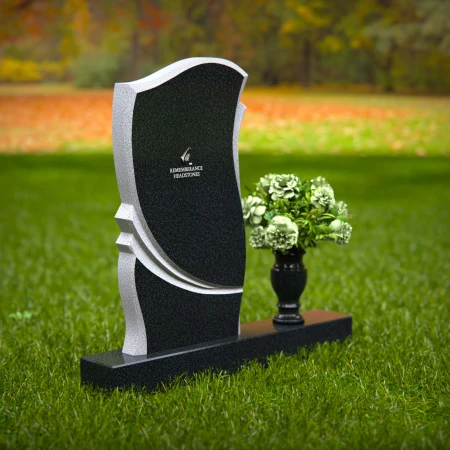 Elegant granite headstones with curved design and flower vase.