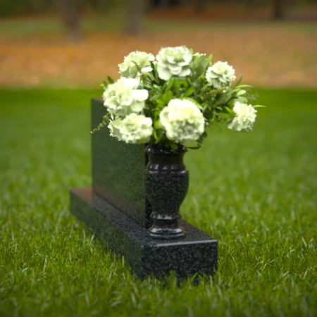 Elegant headstones featuring custom memorial designs and flower vases.
