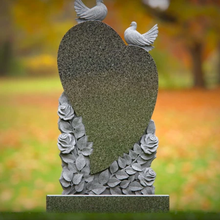 Doves rise around heart shape etched with floral memory in grave markers