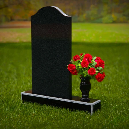 Classic upright headstones with flower vase for timeless memorials.
