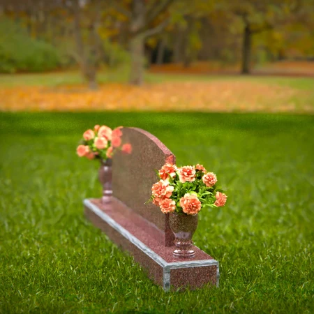 Dual vase headstones with arched design honoring shared memories.