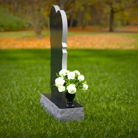 Modern heart-shaped granite headstones with elegant layered design.