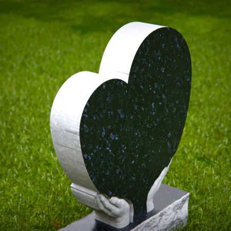 Comforting headstones with sculpted hands gently cupping heart