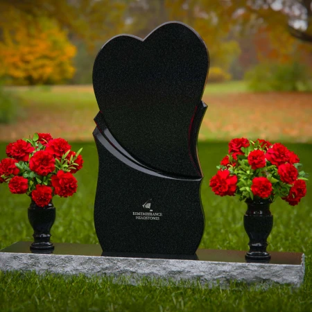 Unique dual heart headstones with twin flower vases for memorials.