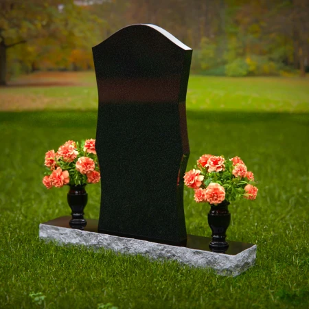 Elegant headstones with unique contours and dual flower vases.