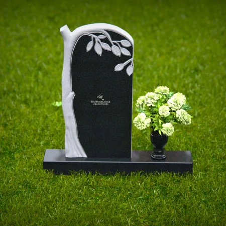 Elegant headstones featuring a tree design symbolizing growth and life.