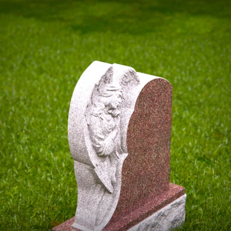 Graceful presence keeps memory alive through memorials, headstone, and grave ornaments.