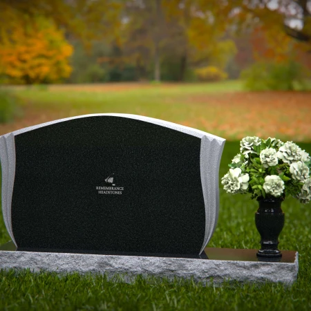 Elegant contoured headstones with flower vase for refined tribute.