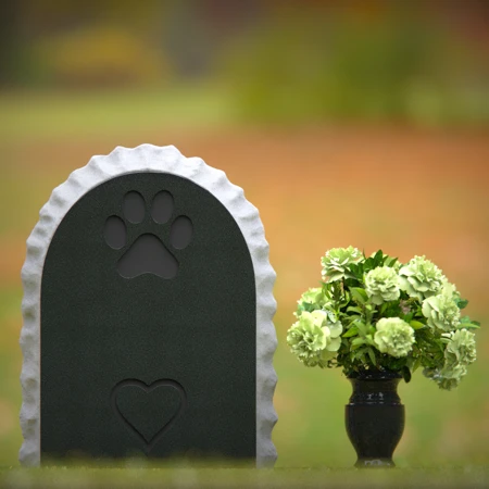 Pet memorial headstones with heart design honoring eternal love.