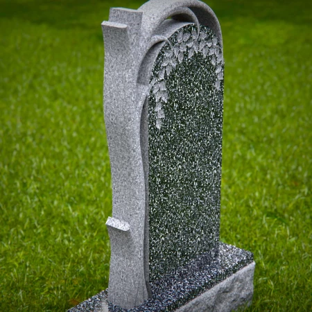 The sheltering arch over a life-giving tree defines these tombstones