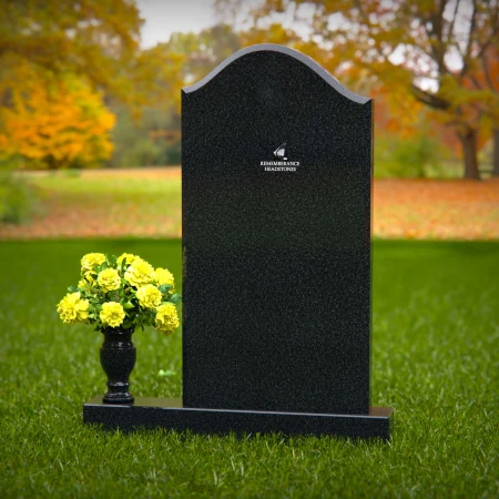 Elegant single granite headstones with curved top and flower vase.