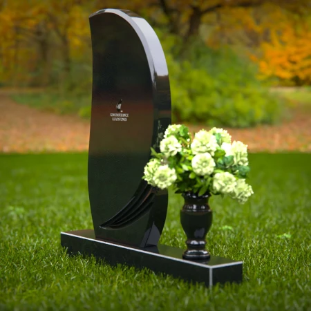 Modern curved headstones with single flower vase for memorials.