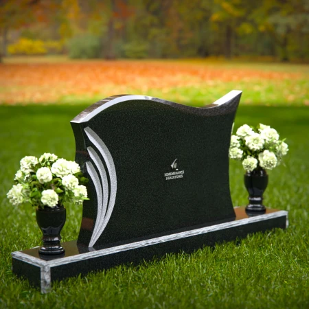 Elegant curved headstones with artistic detailing for a timeless tribute.