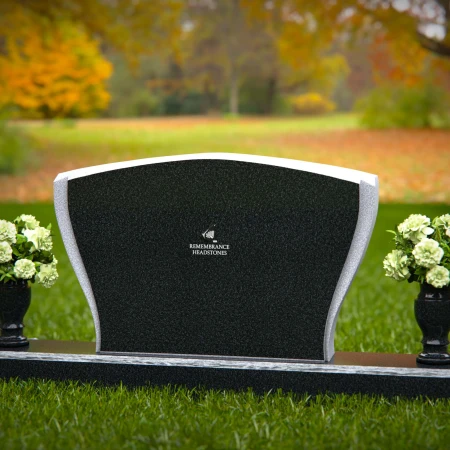 Elegant double vase headstones with contoured design for tribute.