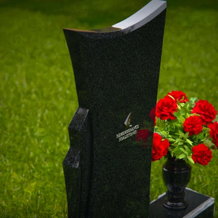 Contemporary granite headstones with unique shape and flower vase.