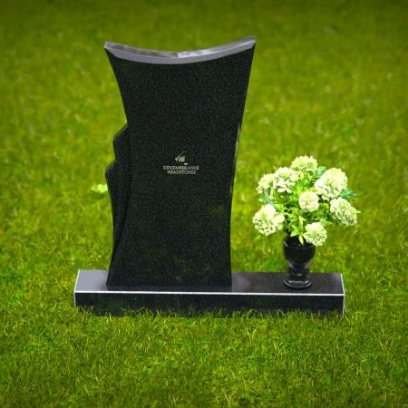 Contemporary headstones featuring a flowing design and floral vase.