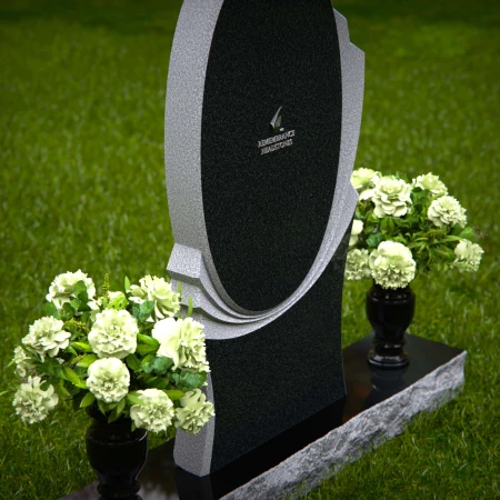 Modern oval granite headstones with layered base for elegant tribute.