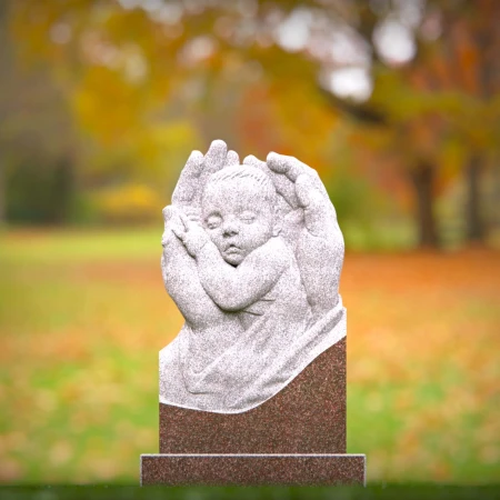 Sacred angel hands holding sleeping baby on headstones