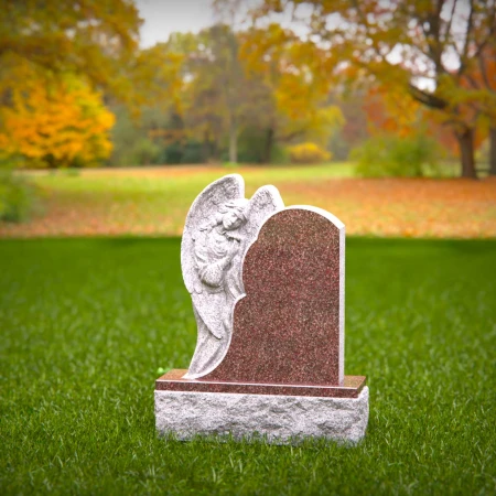 Graceful presence keeps memory alive through memorials, headstone, and grave ornaments.