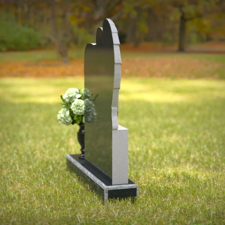 Granite angel heart headstones with floral vases for loving memorials.