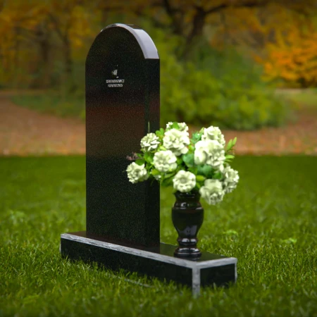 Classic arched headstones with a single flower vase for tribute.